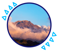 Snow-capped mountain surrounded by clouds in a natural landscape of Colombia